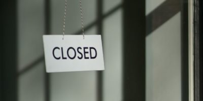 Closed sign outside a dormant premises